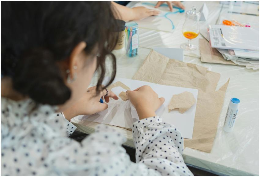 Adults in a Japanese art class engaging in a creat