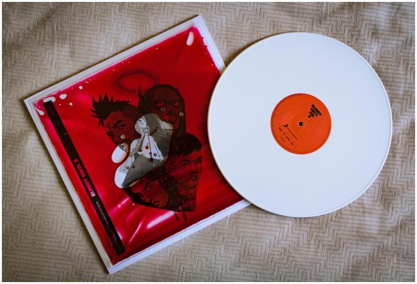 Aesthetic white vinyl record with red cover featur