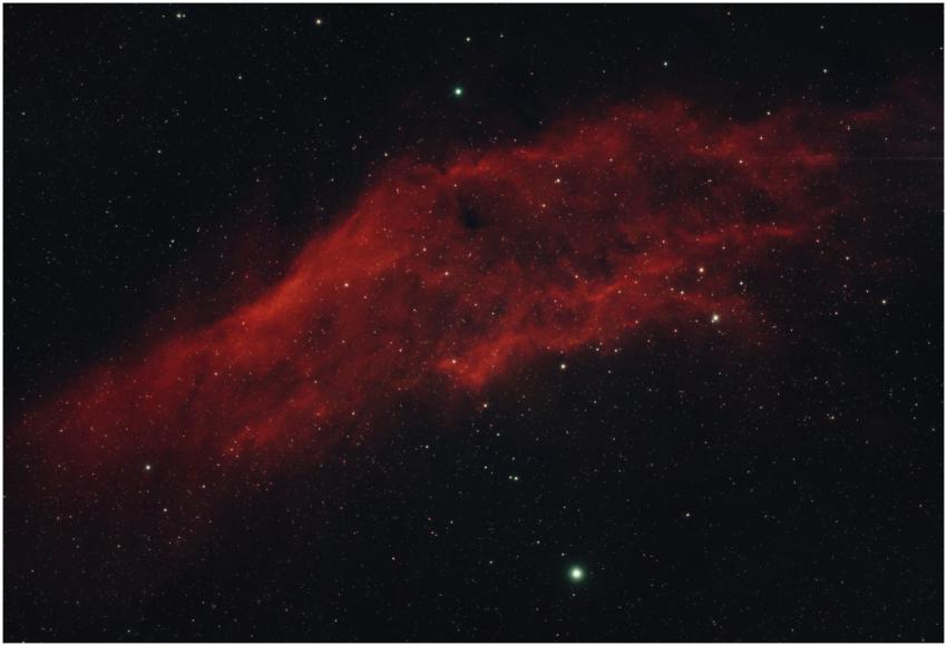 Capture the beauty of a red nebula surrounded by a