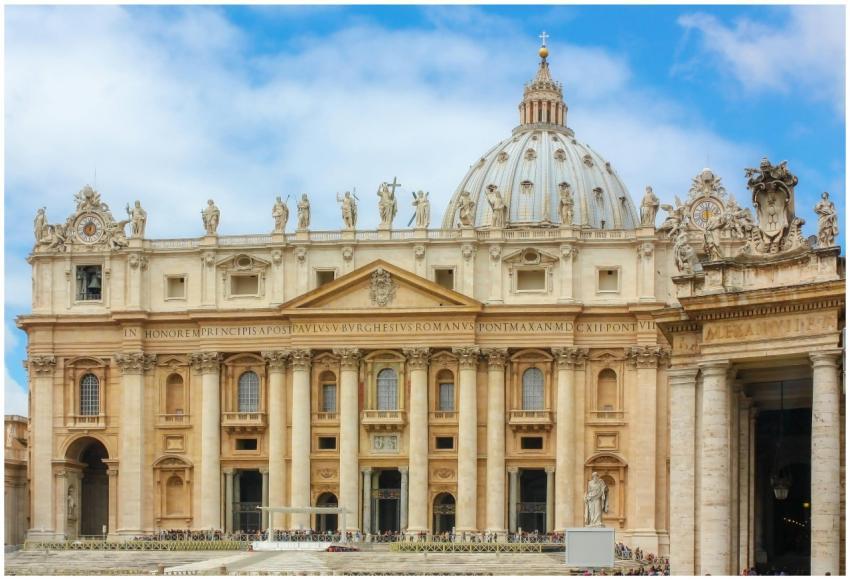 St. Peter's Basilica facade and dome under a brigh