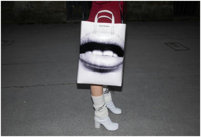 Close-up of a stylish bag with art print, paired w