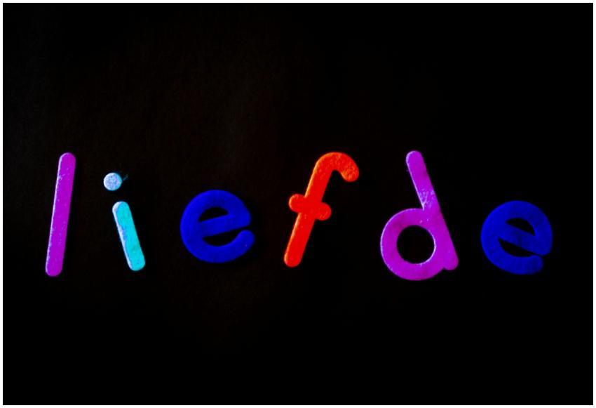 Vibrant cutout letters spelling 'liefde' with love