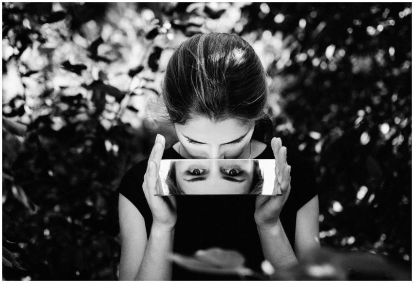 Black and white portrait of a woman gazing into a