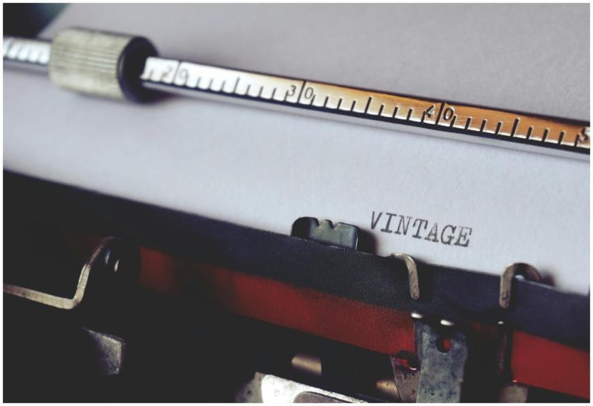 Close-up shot of a vintage typewriter typing the w