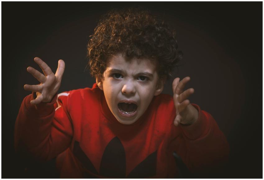 A young child expressing strong emotions during a