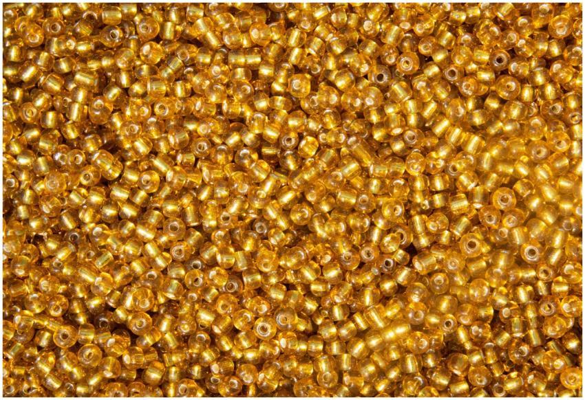 Close-up of vibrant gold beads creating a shimmeri