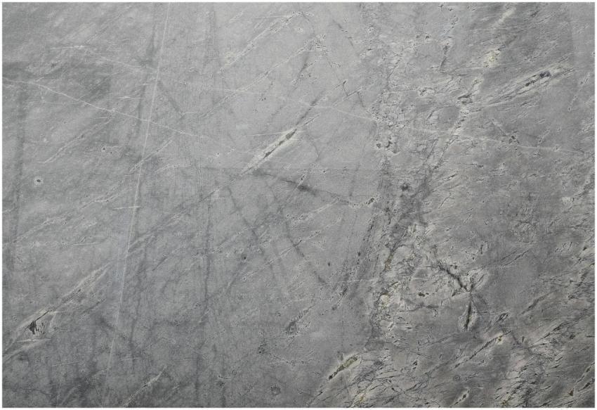 Close-up of a textured grey stone surface suitable