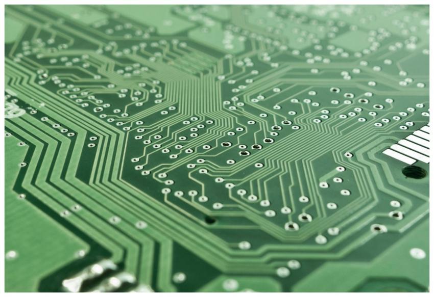 Detailed view of a green circuit board with comple