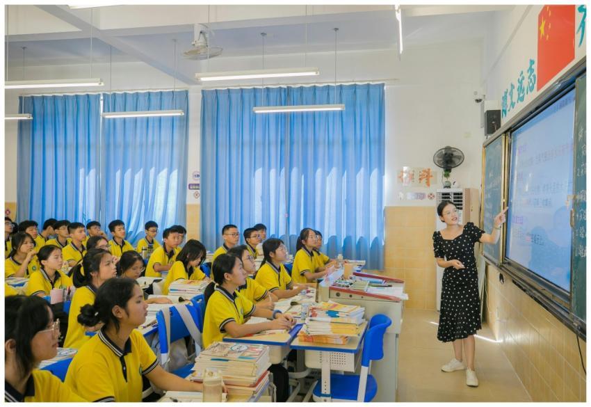 A teacher presents to attentive students in a vibr