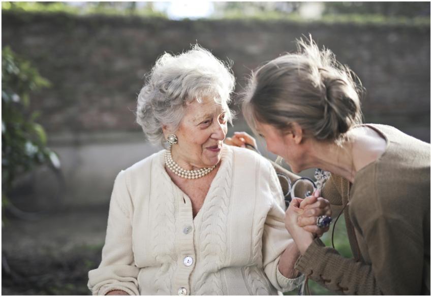 Joyful interaction between an elderly woman and he