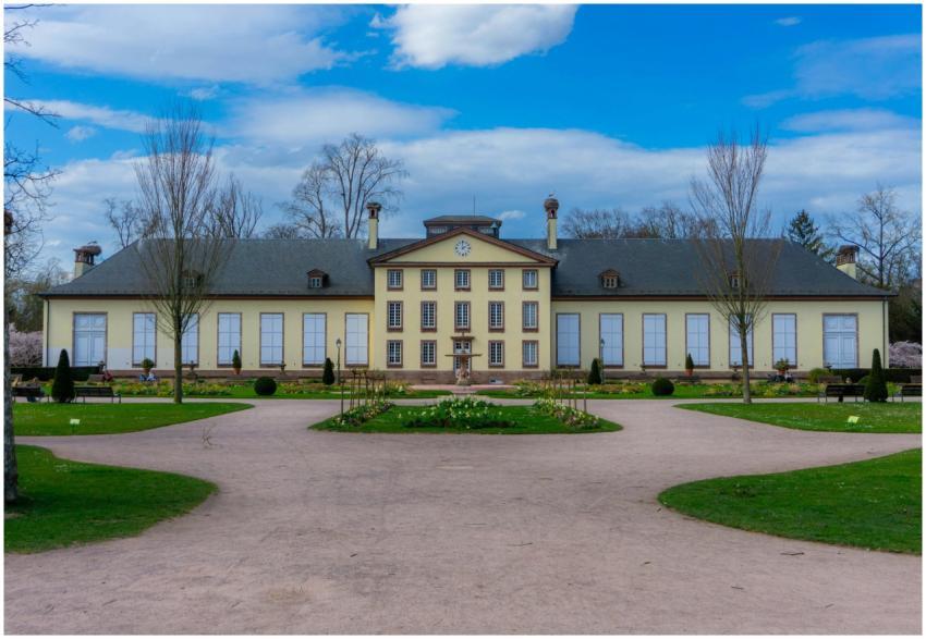 Elegant view of Château de Pourtalès with its lush