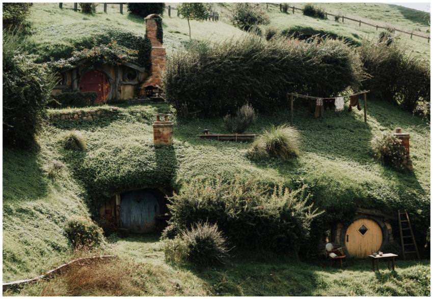 Charming Hobbiton-style houses built into lush gre