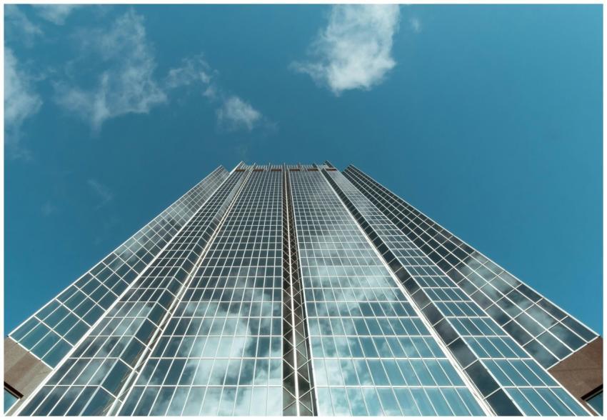 Futuristic skyscraper with glass facade reflecting