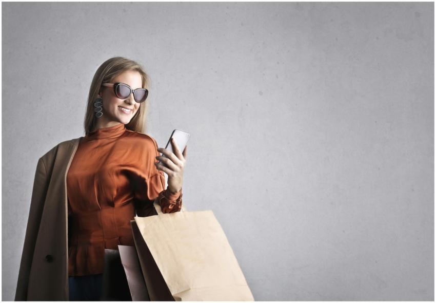 Smiling female in trendy wear and stylish sunglass