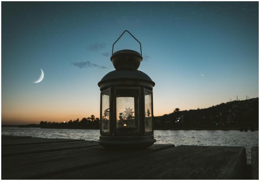 Serene evening scene featuring a lantern on a dock