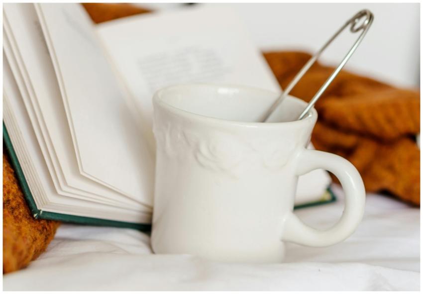 A warm and inviting scene with tea and a book on a