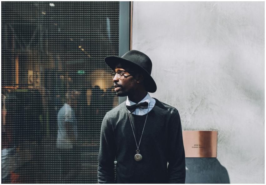 Chic portrait of a fashionable man wearing a hat a
