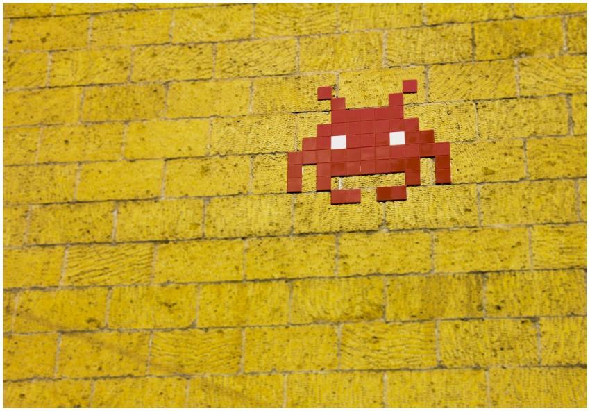 Street art featuring a retro pixelated space invad