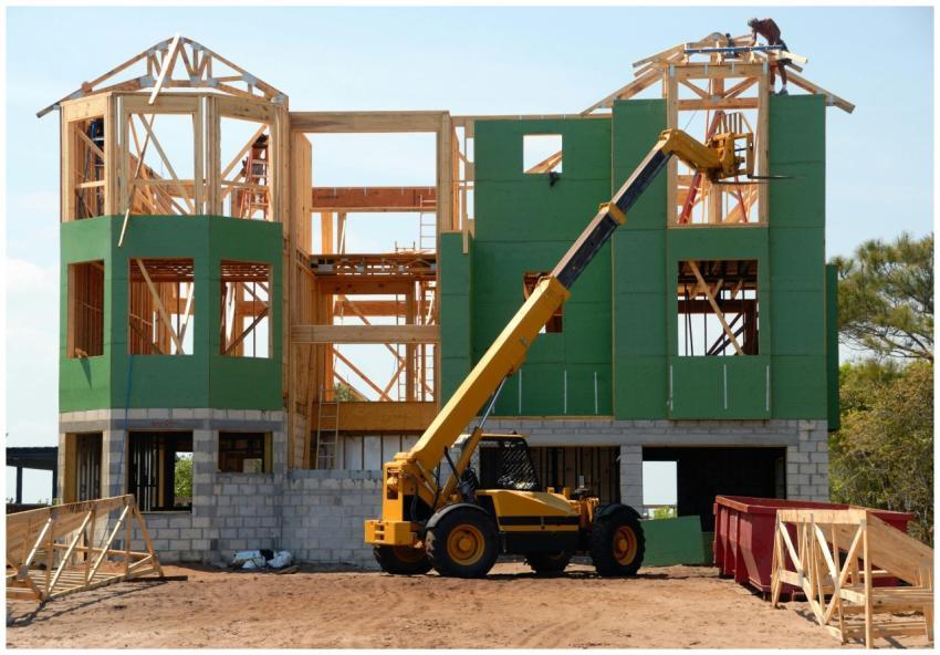 A multi-story wooden house under construction usin