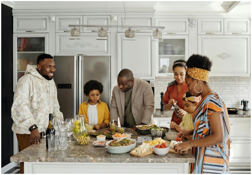 A joyful family together in the kitchen, preparing