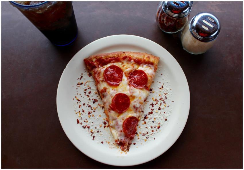 A mouthwatering slice of pepperoni pizza with chee