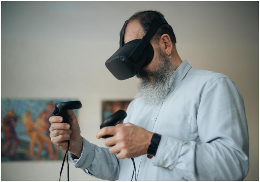 Senior adult playing with VR headset and controlle