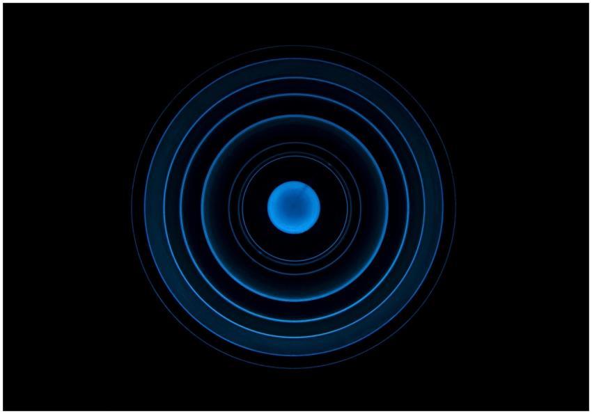 Abstract blue concentric circle pattern on a black