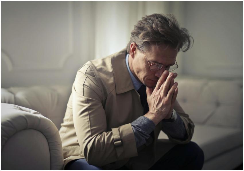 Side view of upset male entrepreneur in formal wea