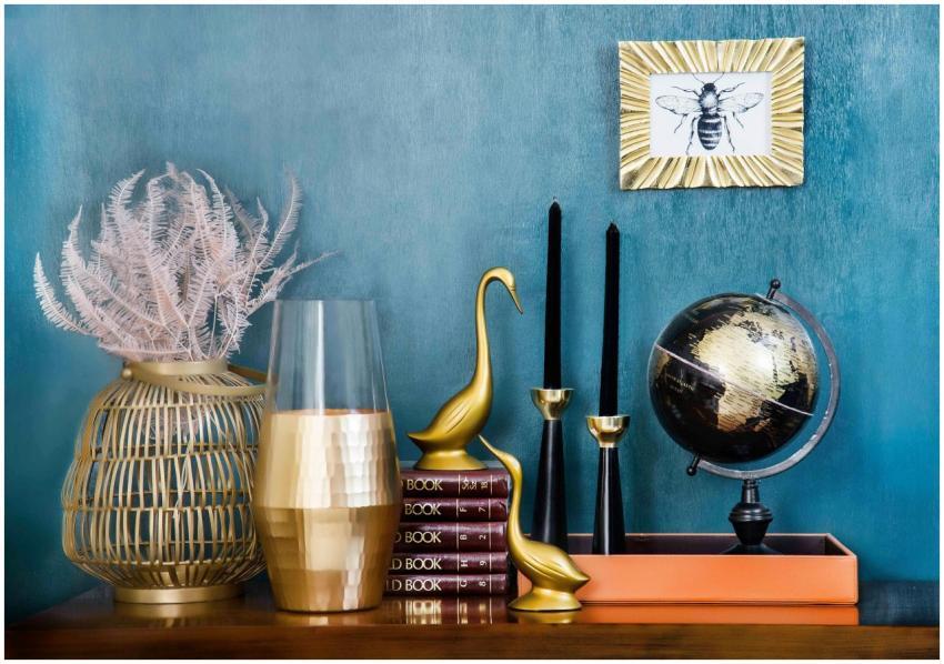 Stylish home decor arrangement including a globe,