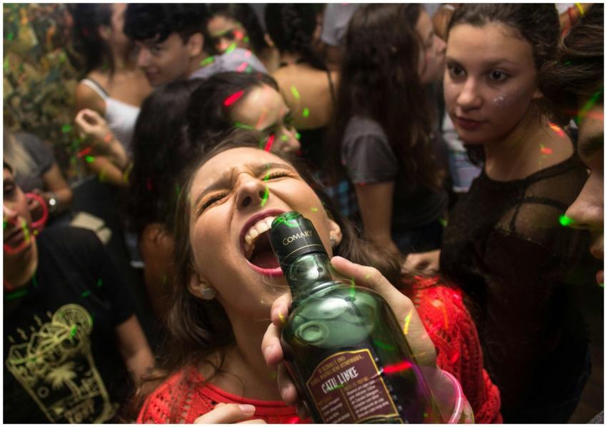 Exciting party scene with young adults enjoying dr