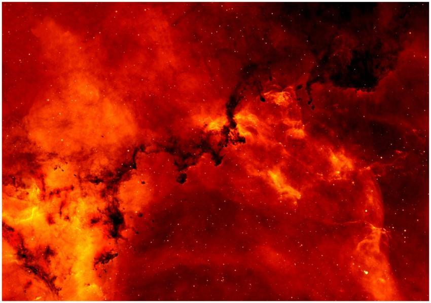 A stunning view of a red cosmic nebula, glowing in
