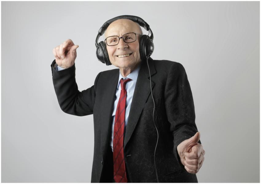 Happy senior man in formal attire delighting in mu