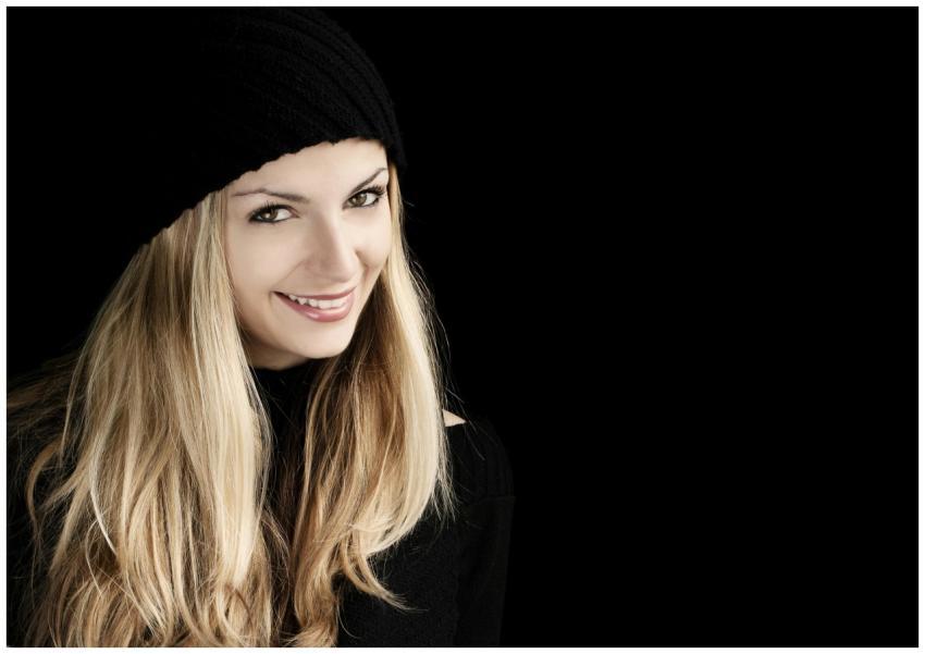 Beautiful woman with long blonde hair smiling in a