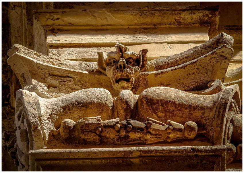 Close-up of a gothic gargoyle sculpture on a histo