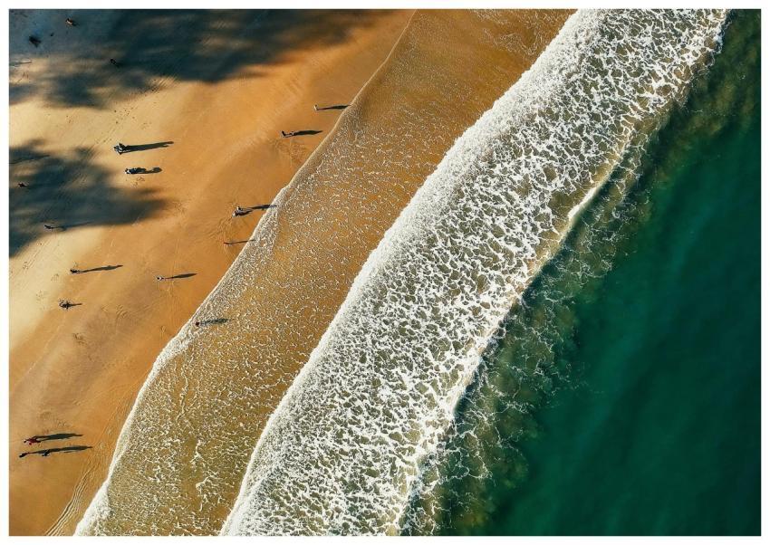 Aerial view capturing a tranquil beach scene with