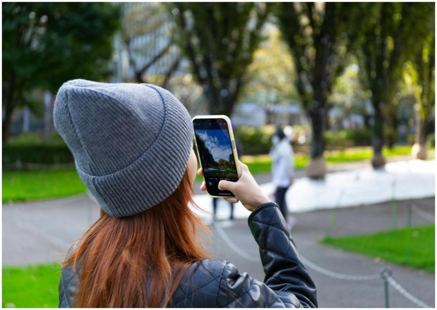 Young woman in Tokyo's Minato City capturing park