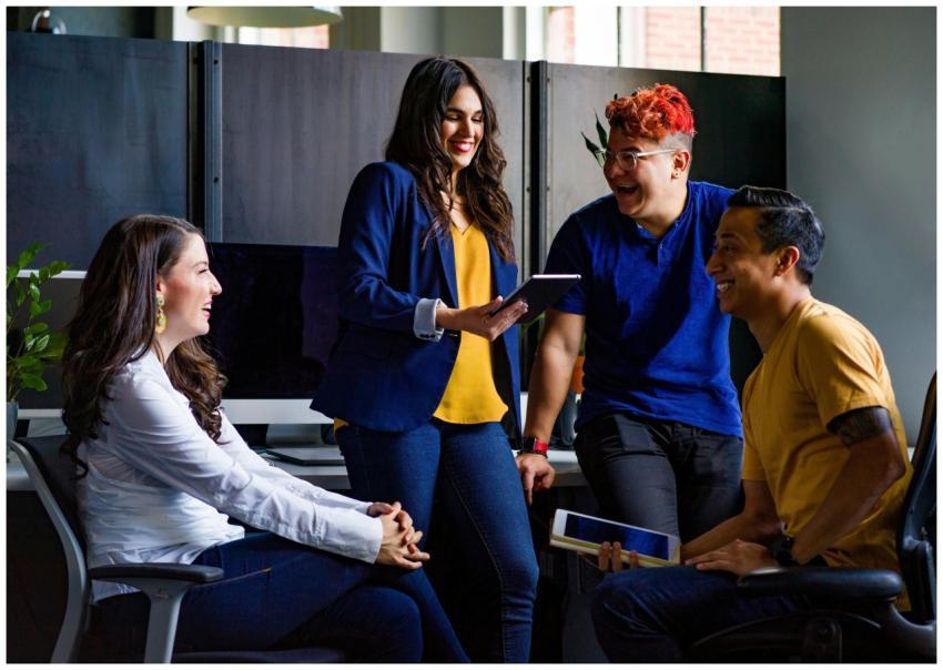 A diverse group of coworkers engaging in a lively