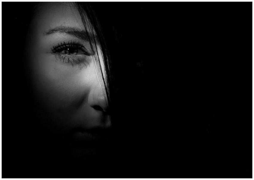 Mysterious black and white portrait of a woman's f