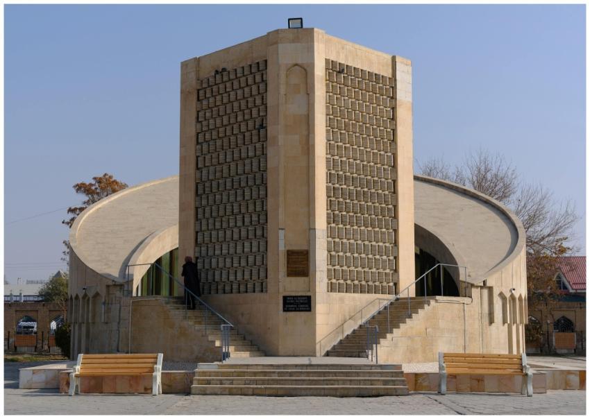 Unique modern building with stone facade and curve
