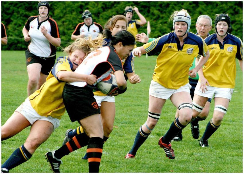 Intense women's rugby match showcasing athleticism
