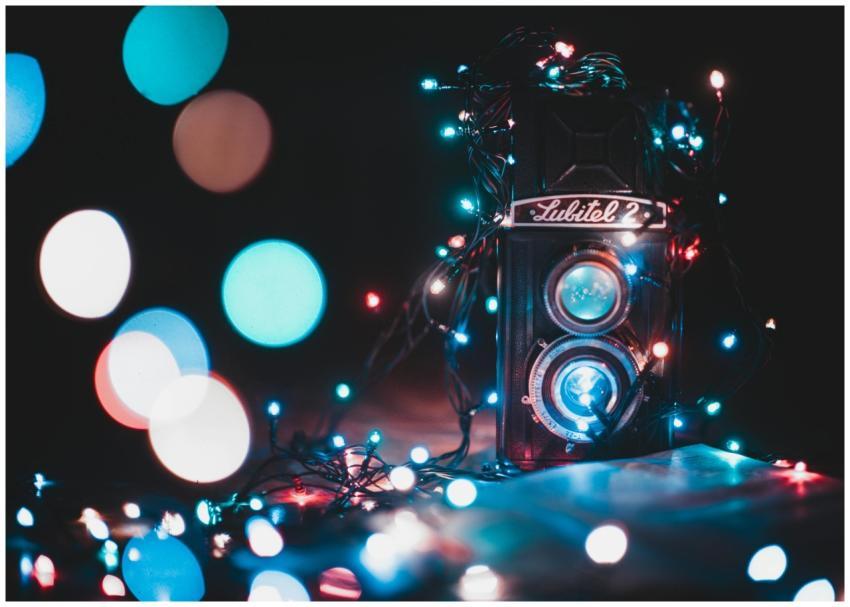 A vintage Lubitel 2 camera surrounded by colorful