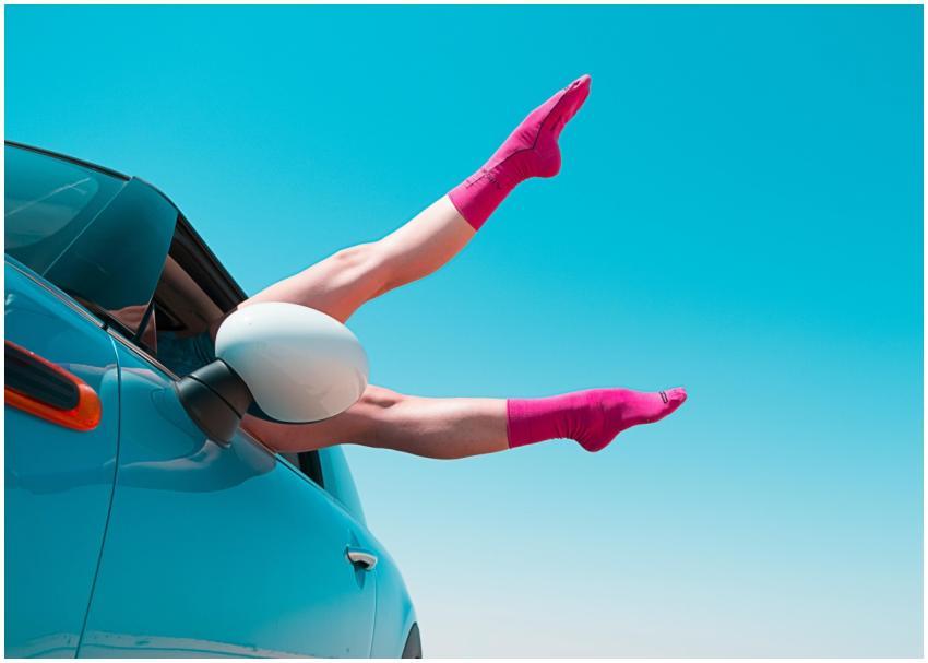 Playful image of a woman's legs in pink socks exte