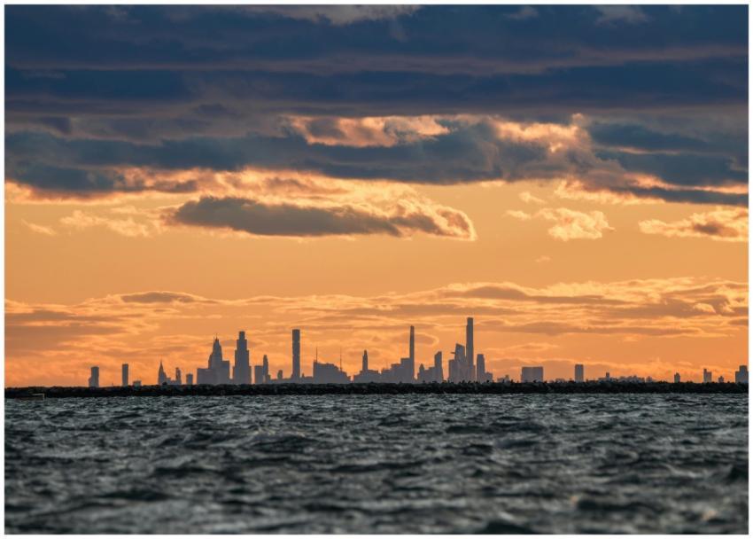 Stunning silhouette of a city's skyline at sunset,
