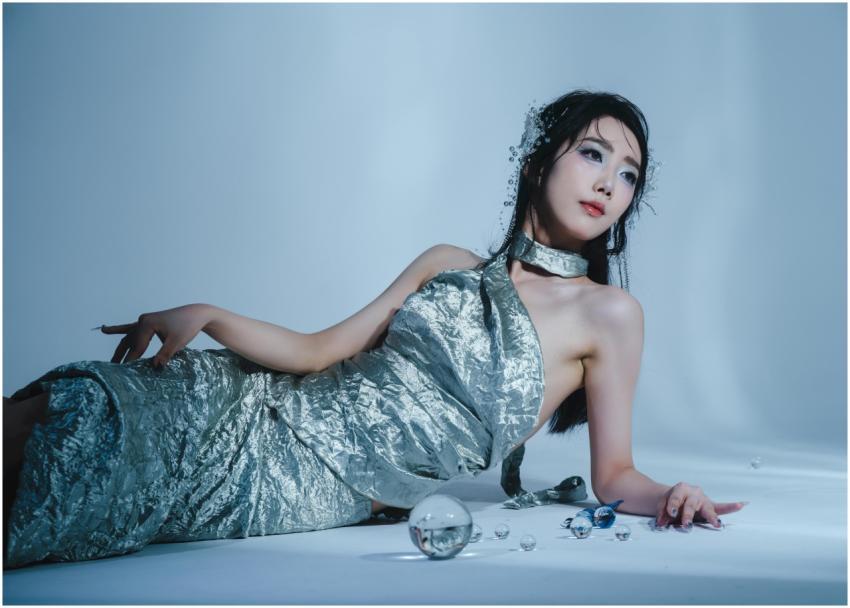 Artistic portrait of a woman in a silver metallic