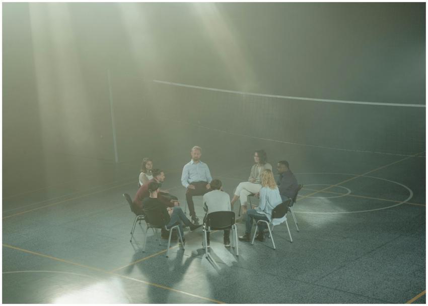 A diverse group gathering in a gym for a supportiv