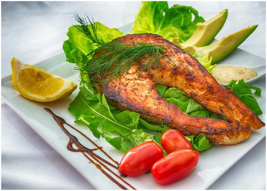 Delicious grilled salmon served with fresh vegetab