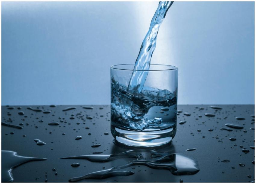 High-quality image of water being poured into a gl