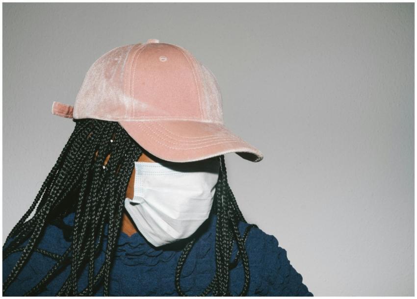 A contemporary portrait of a woman with braided ha