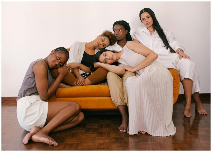 Group of diverse women sharing a tender moment ind