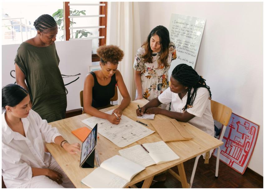 Diverse team collaborates on a project using digit